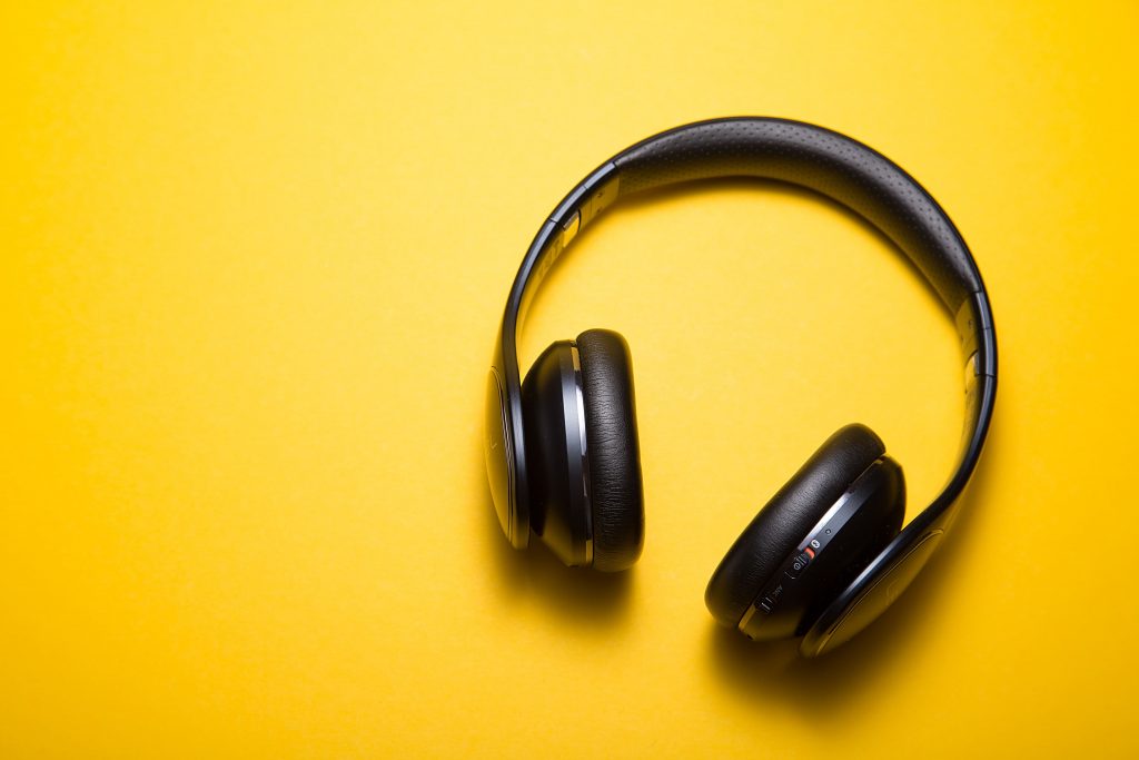 headphones against a yellow background