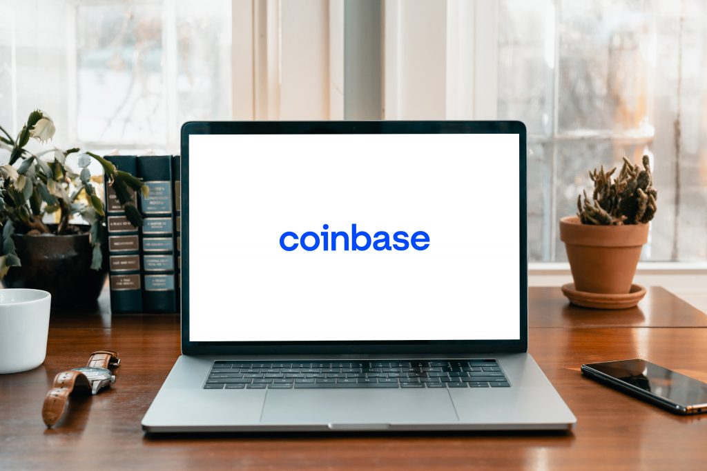 Coinbase logo on a laptop screen
